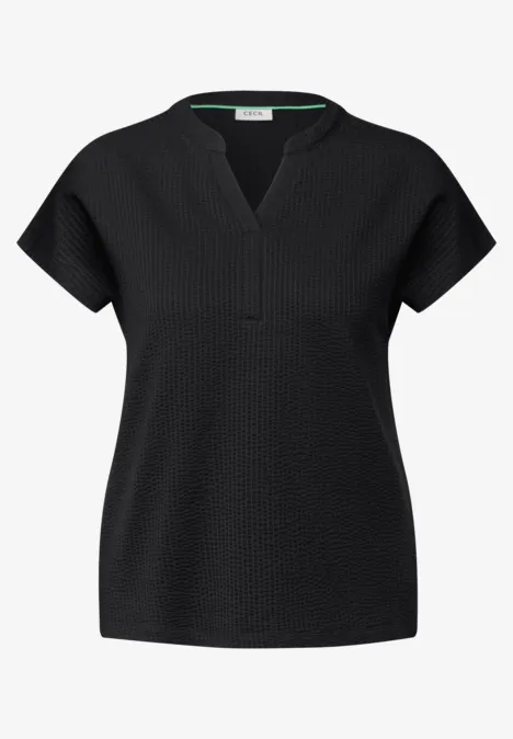 Schwarzes, kurzärmeliges Damen-Shirt mit V-Ausschnitt.